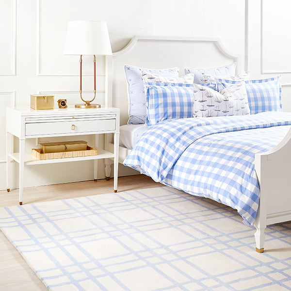 French Blue Tufted Livingston Oversized Plaid Rug in Bedroom