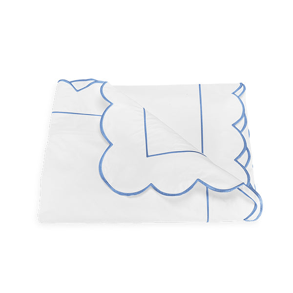 Folded Matouk Butterfield Duvet Cover with Blue Scalloped Edge