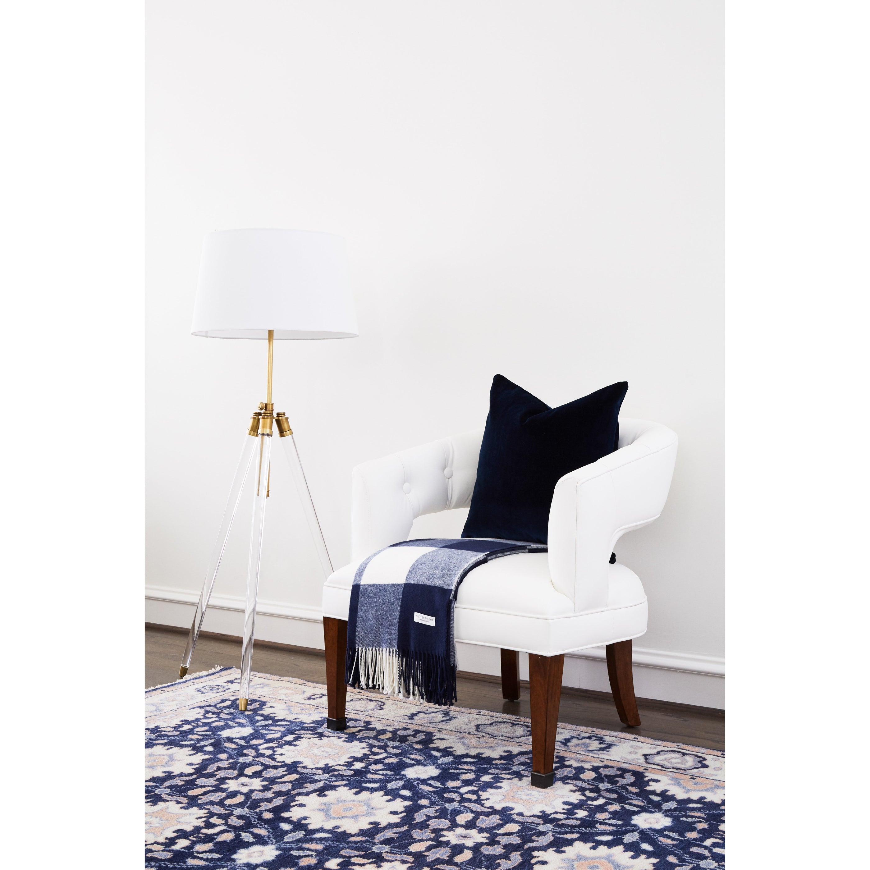 Navy Velvet Throw Pillow on White Chair