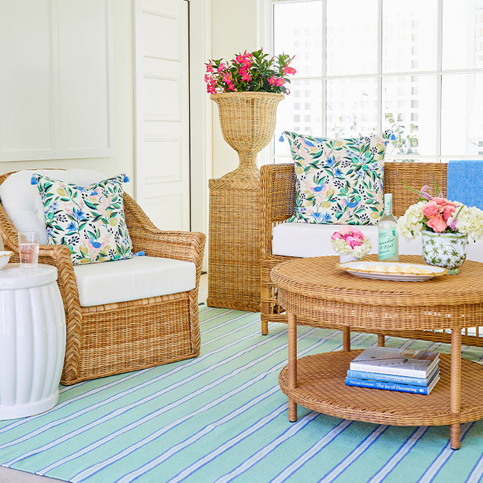 Sunroom with Woven Wicker Furniture and Planter with Flowers