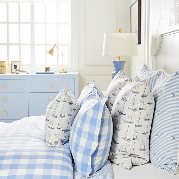 Bed with Blue Sailing Pillows