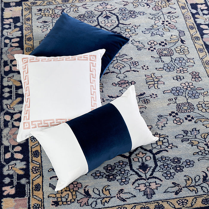 Giovanni Pillow in Rose with Navy Throw Pillows on Rug