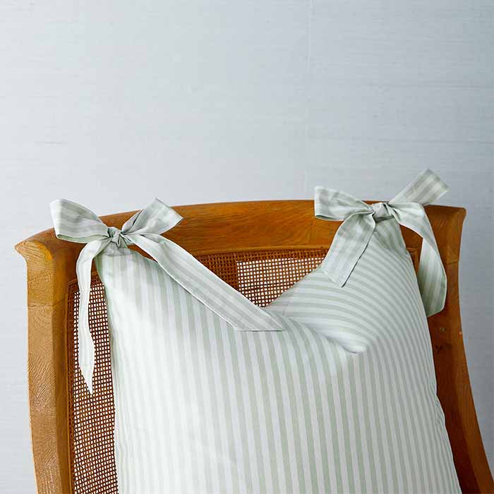 Noelle Bow Pillow in Wintergreen in Chair