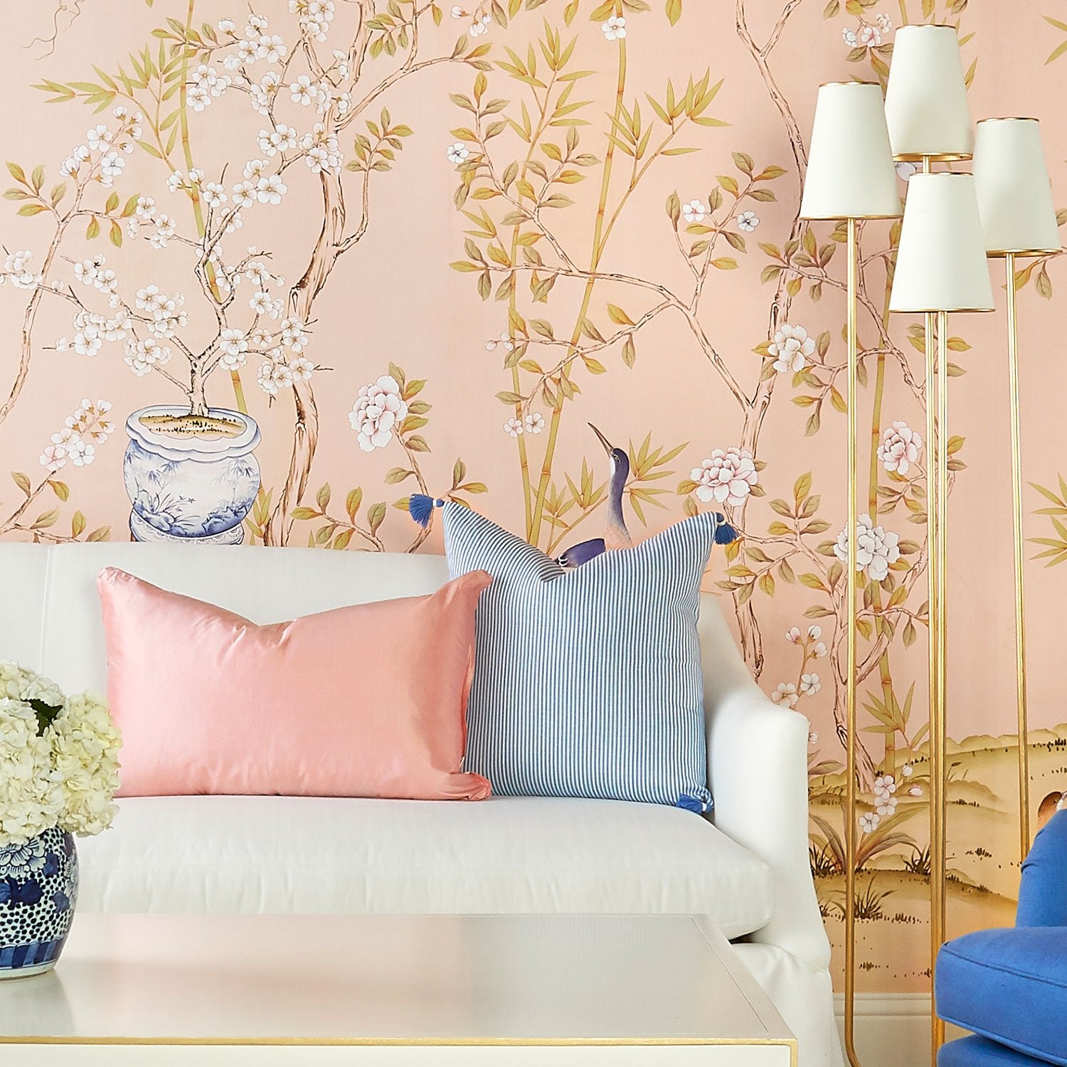 Belfort in Blush Pink Chinoiserie Wallpaper Mural Behind Sofa