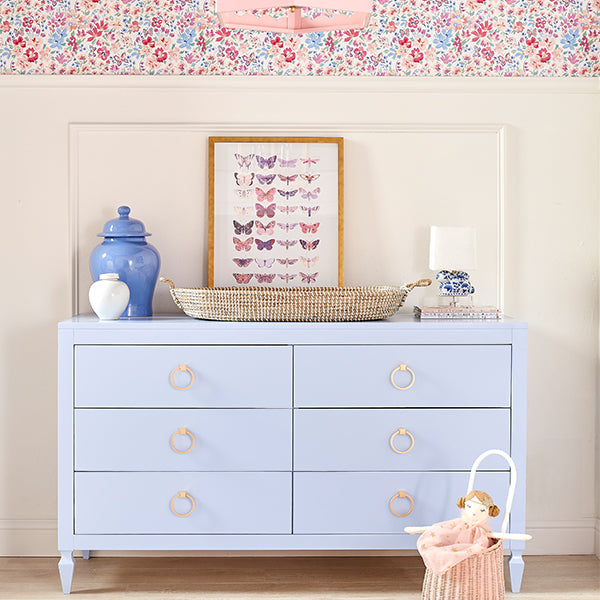Aiden Airway Blue Dresser in Floral Nursery Room