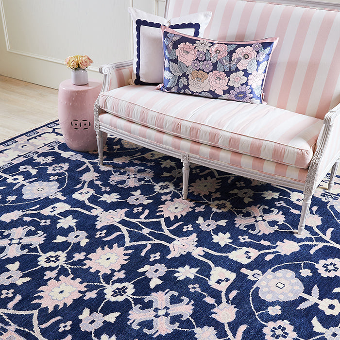 Minuet Wool Area Rug in Navy under Pink Settee 