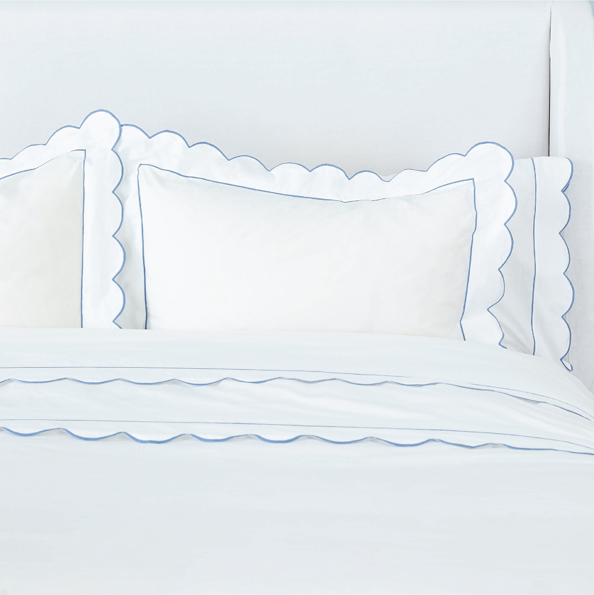 Blue Scallop Edge Matouk Butterfield Sheets, Pillow Shams, and Duvet Cover on Bed