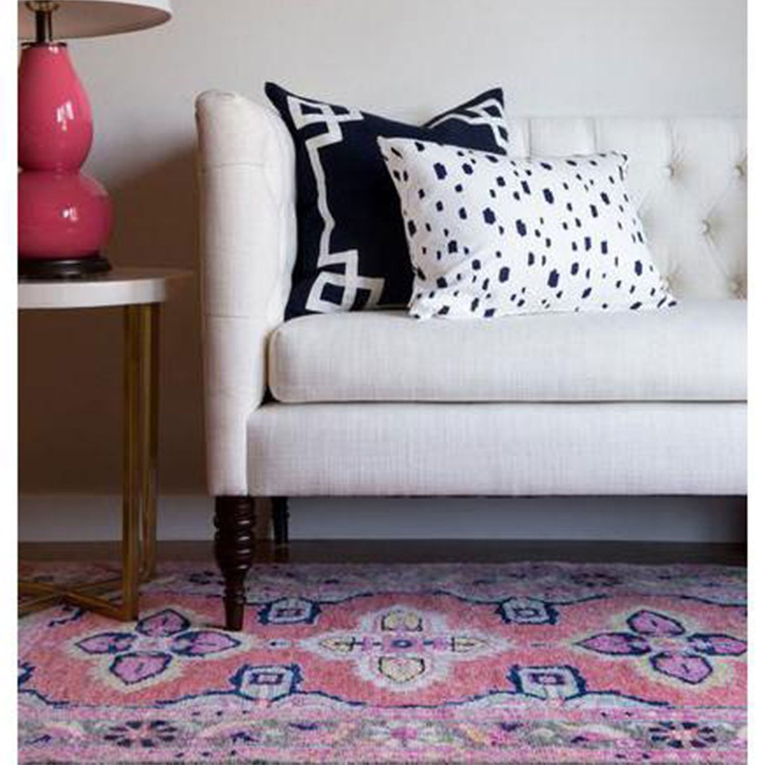 Kismet Area Rug in Coral Under Sofa