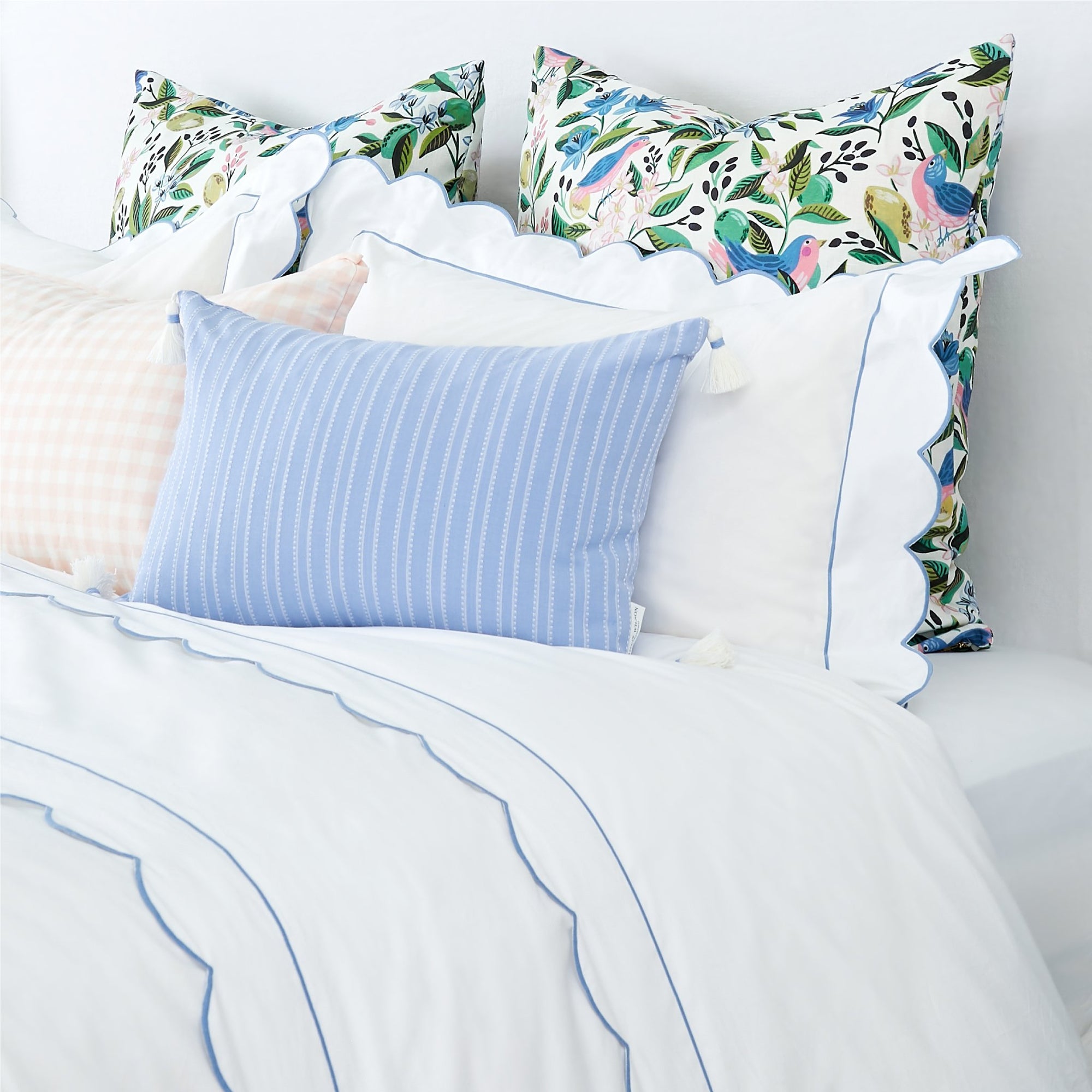 Matouk Butterfield Sham with Ocean Blue Scalloped Edge on Bed