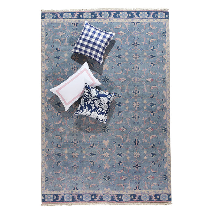 Lucy Floral Area Rug in Blue with Throw Pillows