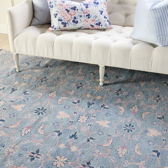 Lucy Floral Area Rug in Blue Under Sofa