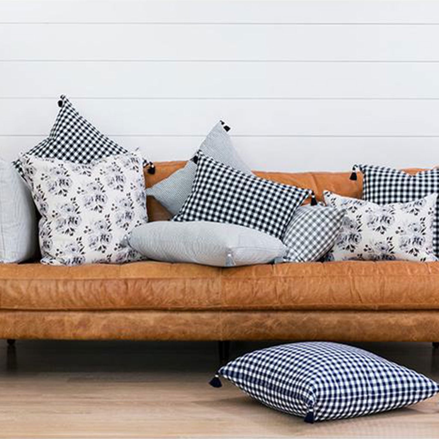 Grey Gingham Pillow with Tassels on Sofa