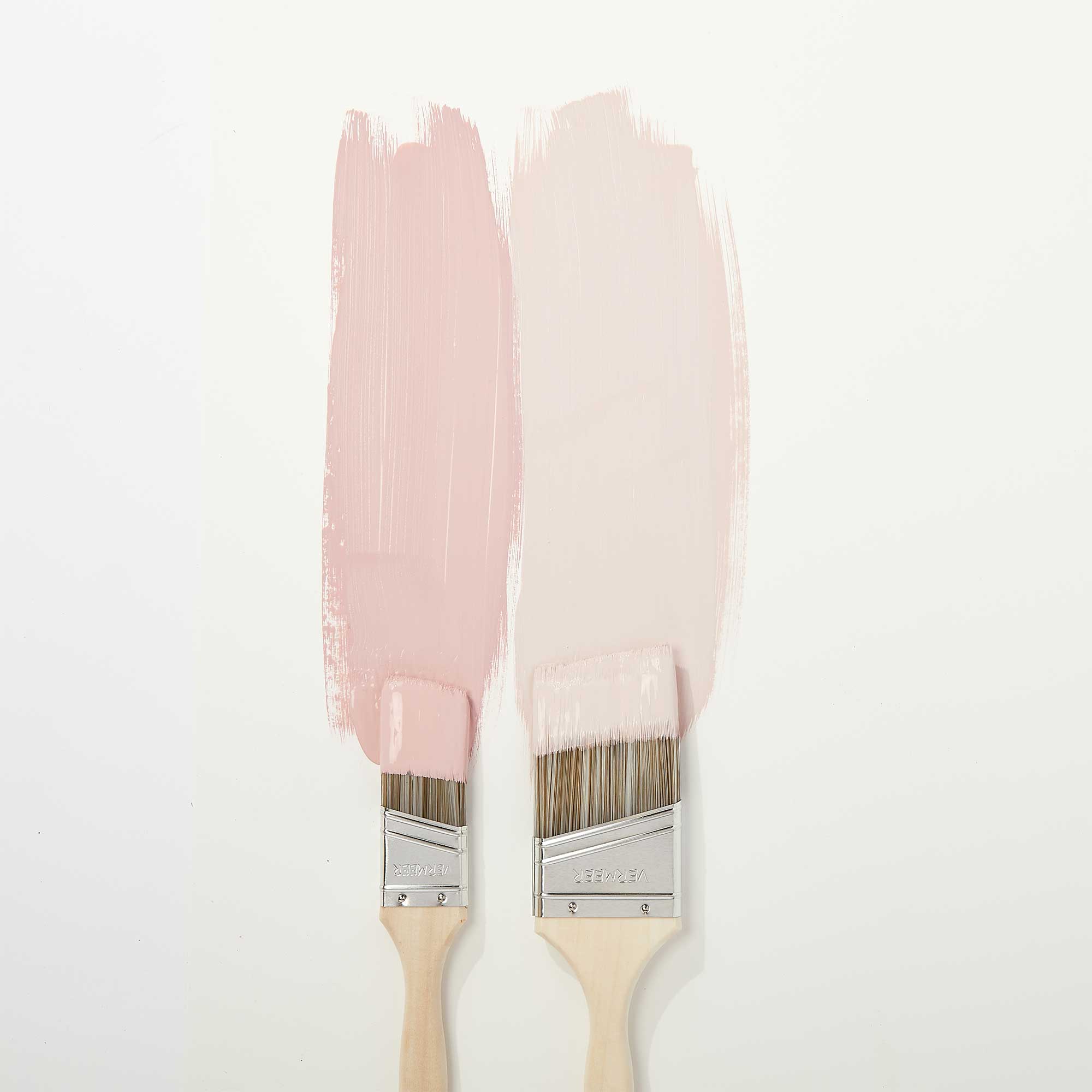 Paint Brushes with Pink Paint on Wall