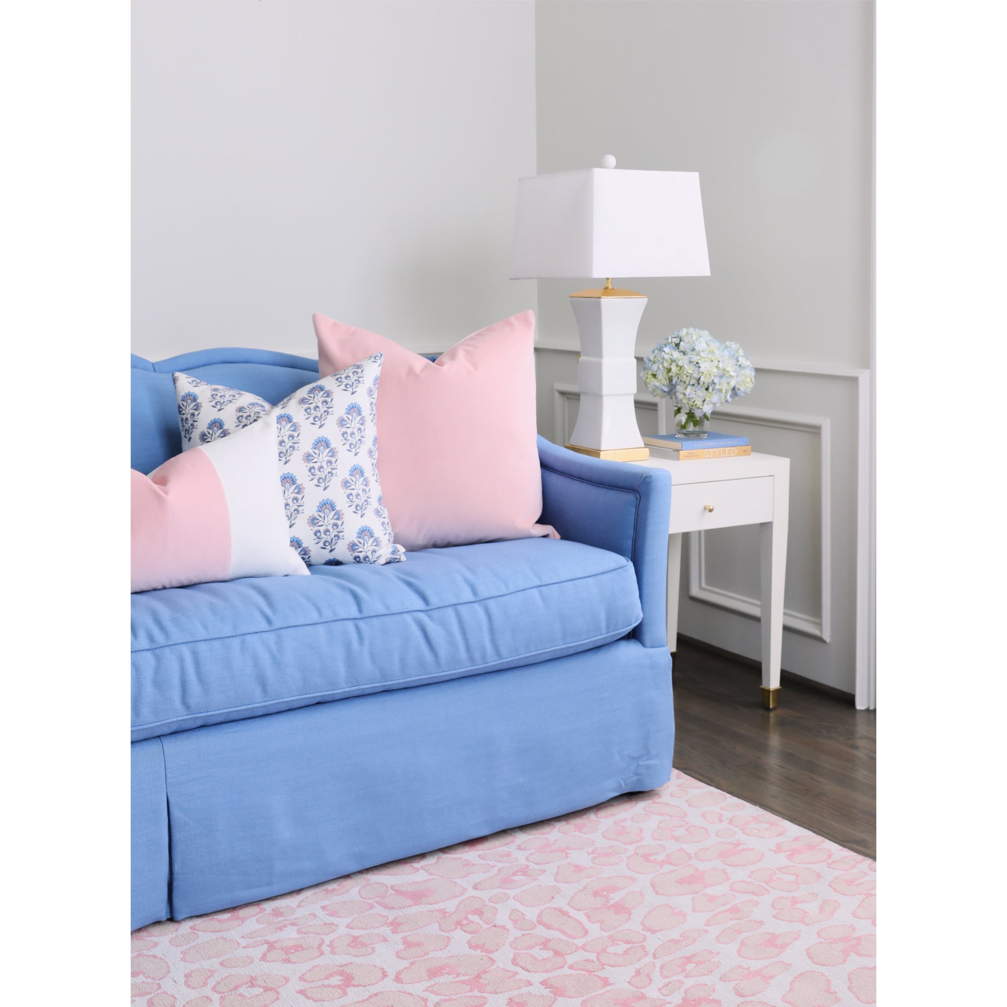 Blush Velvet Pillow on Blue Sofa