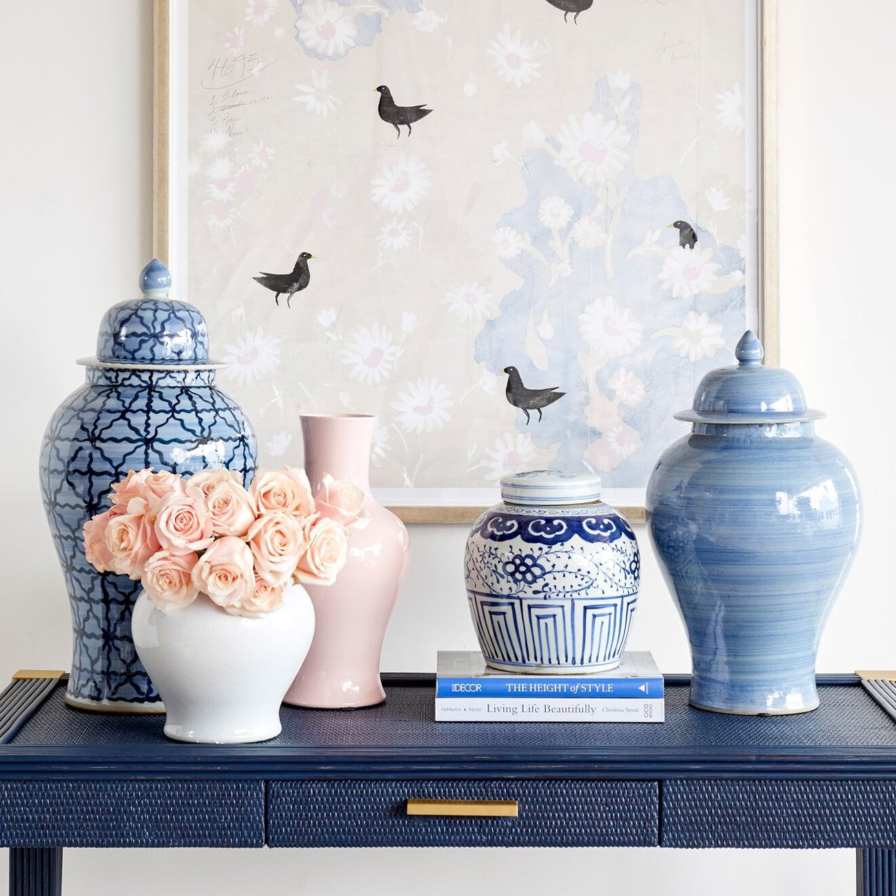 Paintbrush Temple Jar on Blue Table with Coordinating Pottery