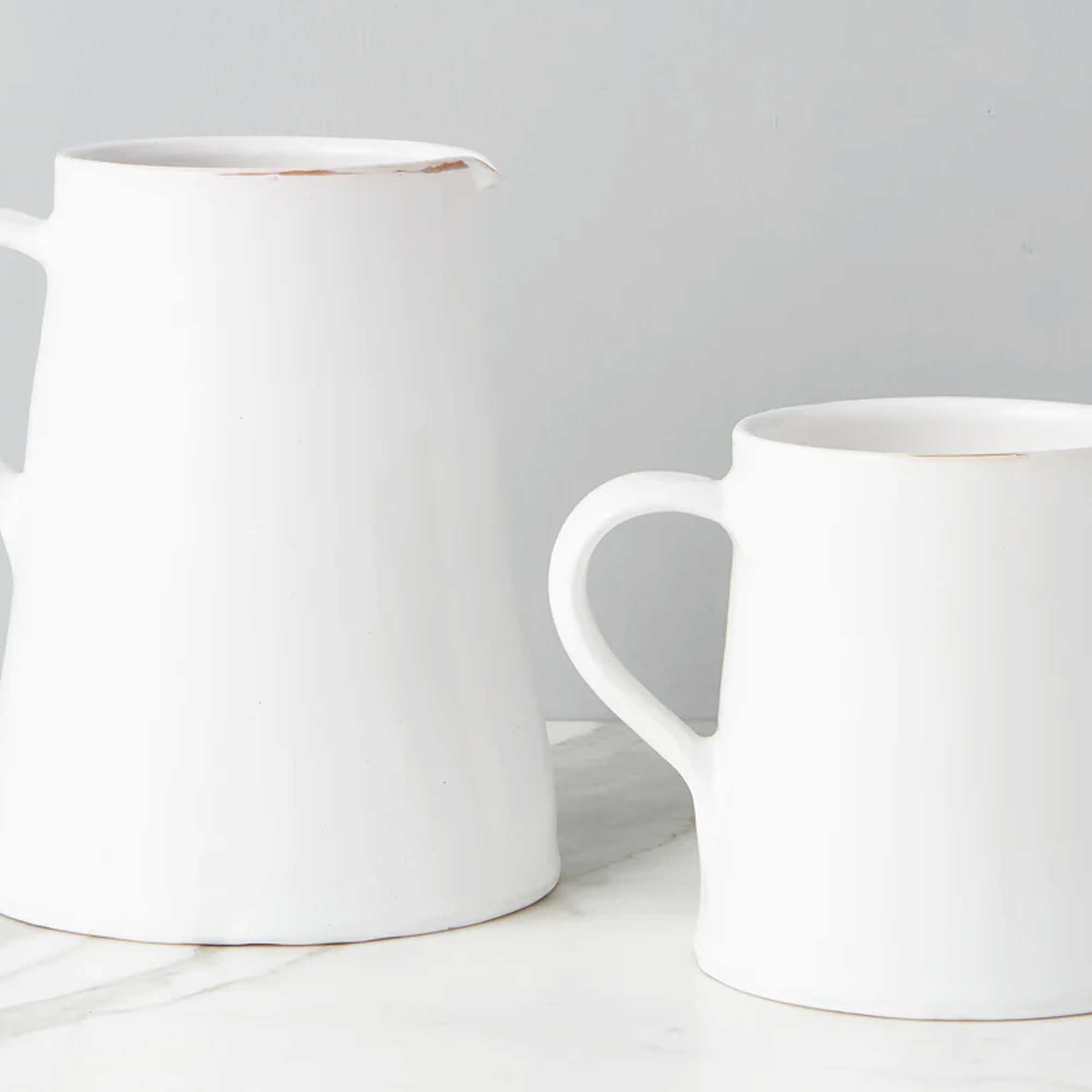 Large and Small White Water Jugs