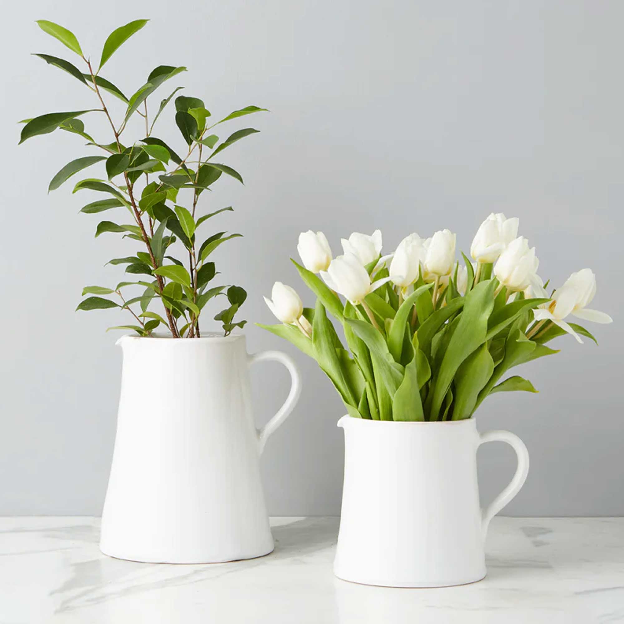 Large and Small White Water Jugs with Flowers