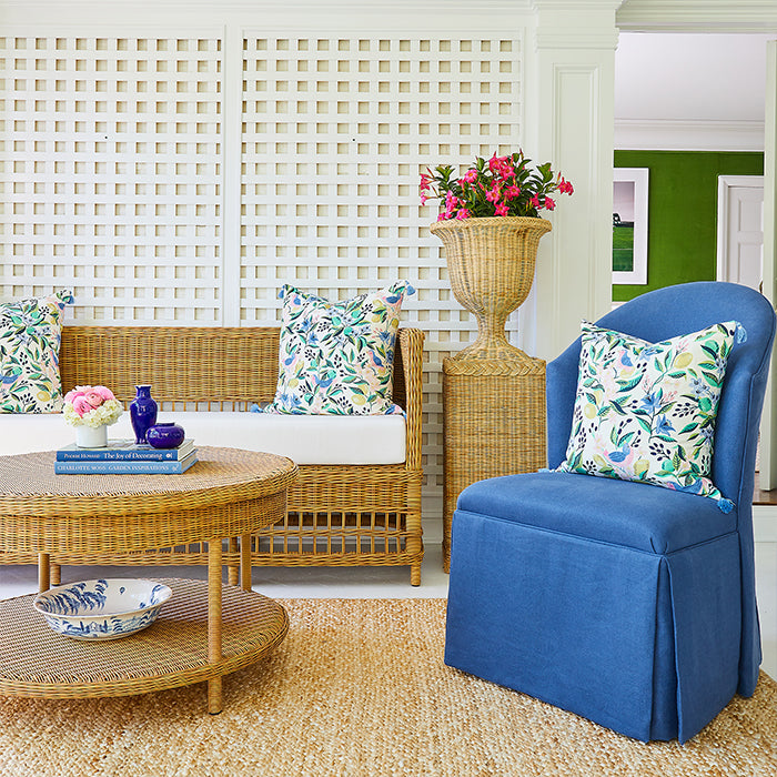 Woven Planter on Pedestal with Flowers on Outdoor Patio